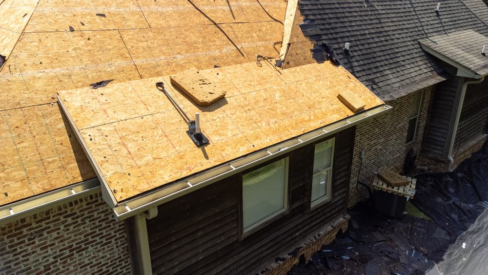 A new roof being installed on a house following hail damage.






