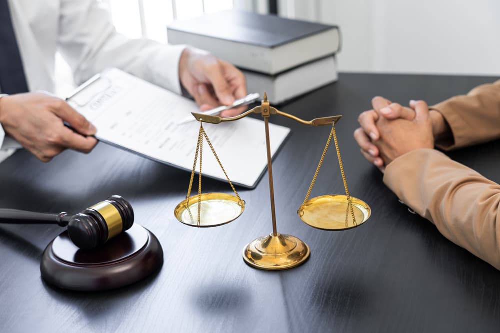 A lawyer or judge presents a client with contract documents, symbolizing the concept of law and legal services.