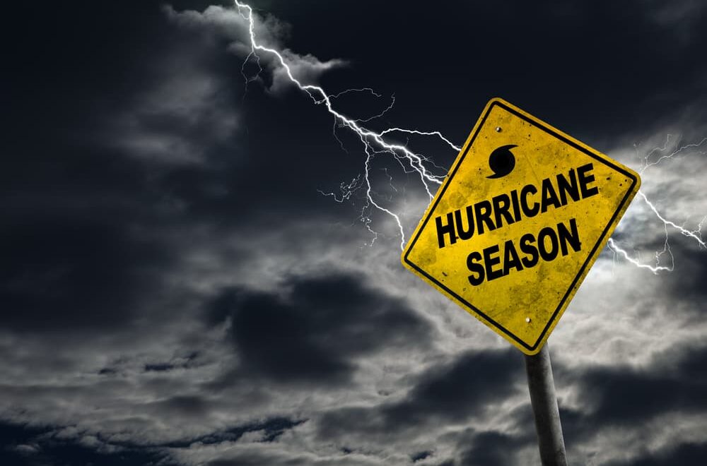 A symbol representing hurricane season set against a stormy backdrop, featuring ample copy space.