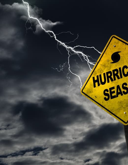 A symbol representing hurricane season set against a stormy backdrop, featuring ample copy space.