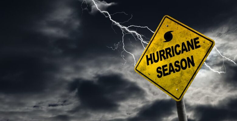 A symbol representing hurricane season set against a stormy backdrop, featuring ample copy space.